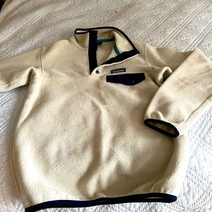 Patagonia sweatshirt size xxs.  Tan with navy blue pocket.